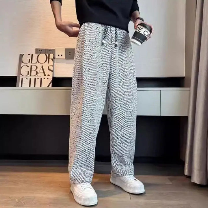 Warm men's brushed knit lounge pants with a modern tapered fit, essential for winter fashion.