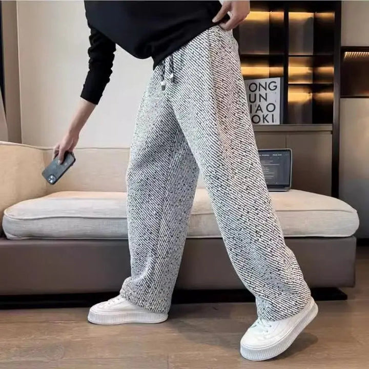 Soft fabric men's lounge pants, tapered and knit, offering superior comfort for casual occasions.