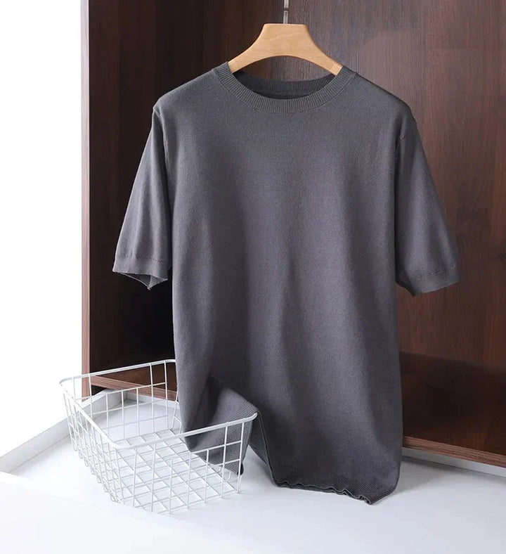 Back view of a plain black men's everyday comfort tee, emphasizing its simple, clean design.