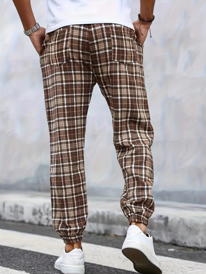 Comfortable men's plaid jogger pants, soft cotton blend, ideal for loungewear.