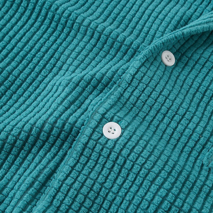 Stylish men's army green long sleeve corduroy button-up shirt, comfortable for casual fall and winter fashion.