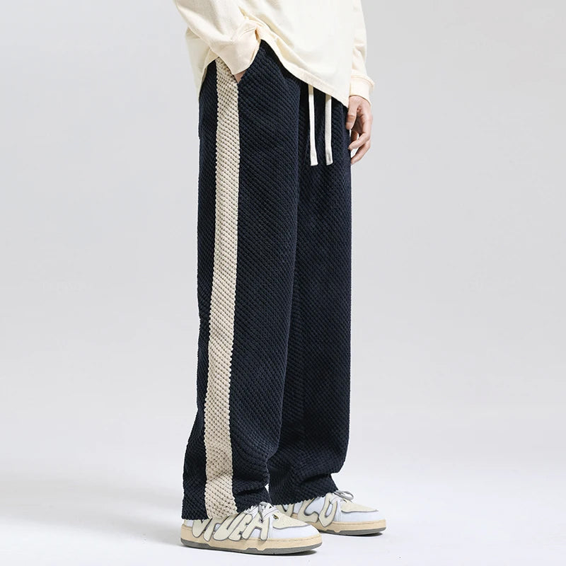 Stylish men's relaxed fit pants in a soft texture, perfect for modern casual wear & everyday comfort. Versatile trousers.