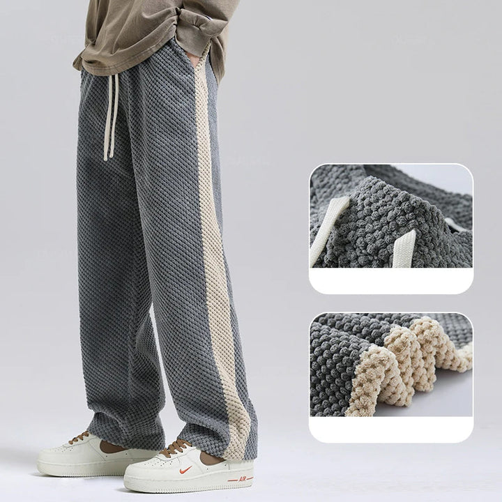 Comfortable men's soft textured pants, featuring a relaxed fit for everyday wear. Modern casual trousers for men.