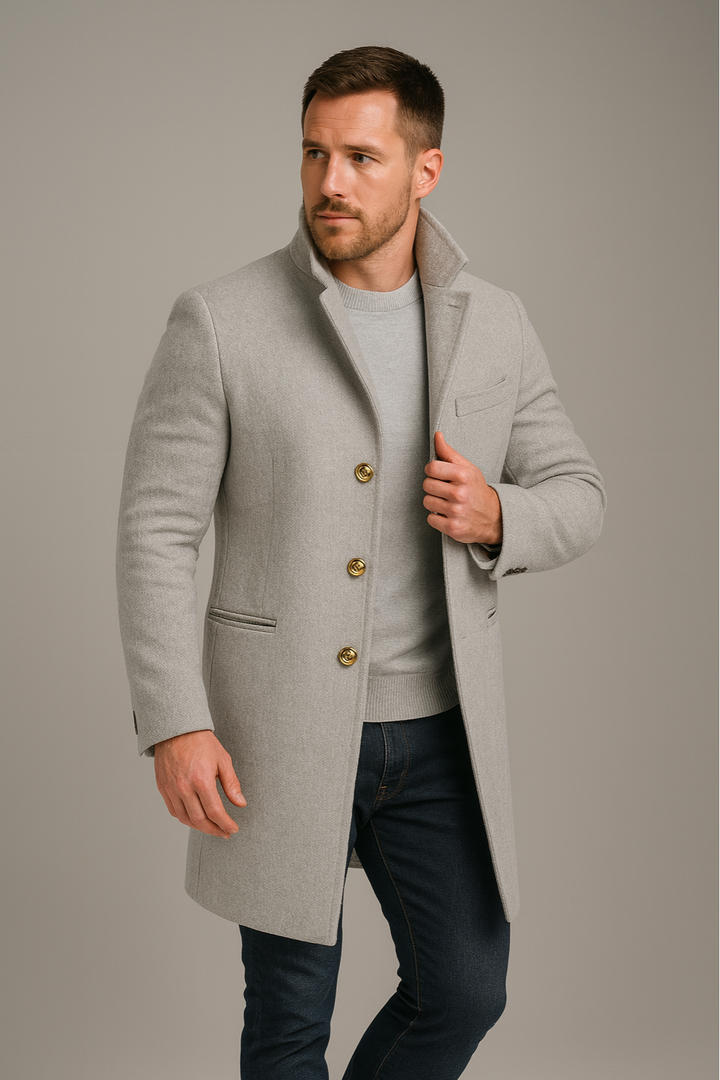 Men's elegant black longline coat with distinctive gold button accents. A stylish single-breasted winter fashion piece.