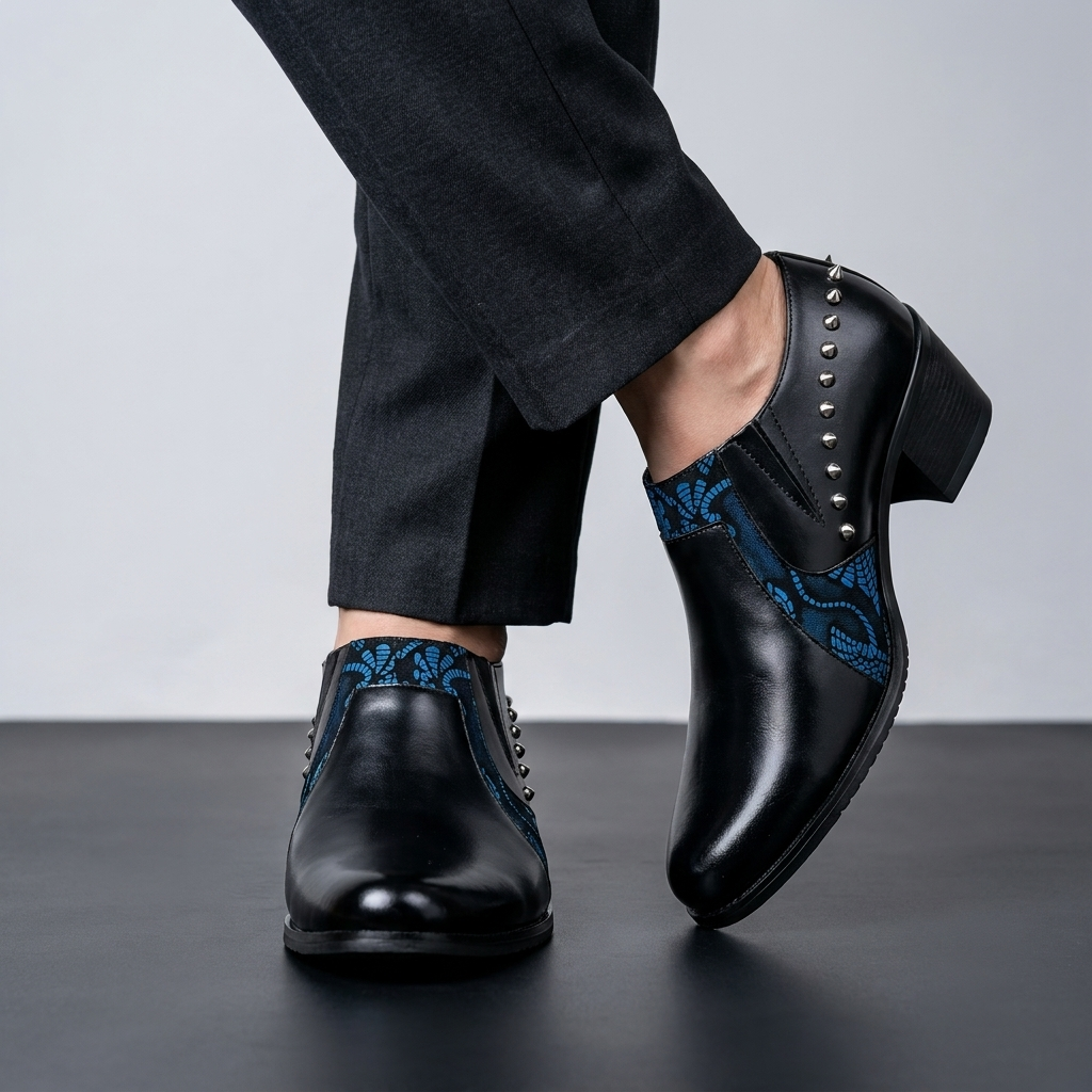 Elegant men's black pointed-toe slip-on loafers, featuring subtle gold accents for a refined, modern look.