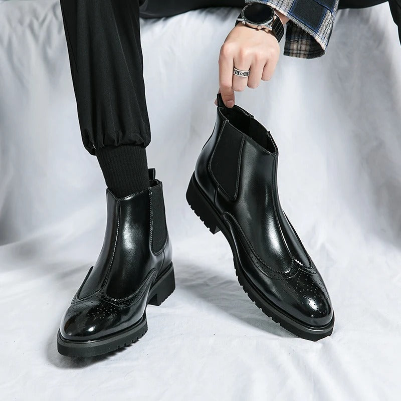 Elegant men's black slip-on Chelsea boots, perfect for formal events or office.