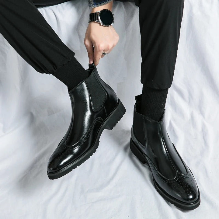 Men's refined slip-on dress boots, Chelsea design with subtle brogue detailing.