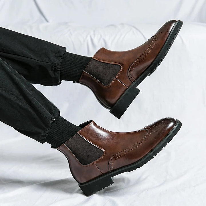 Classic men's black slip-on Chelsea boots, timeless elegance for dress or casual.