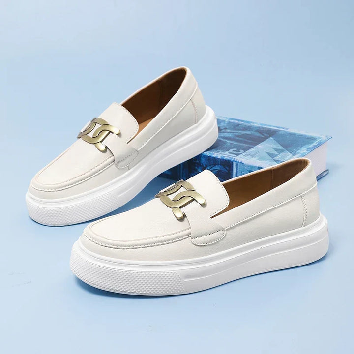 Men's sophisticated slip-on loafers with modern buckle, perfect for smart casual or dress wear. Classic style footwear.