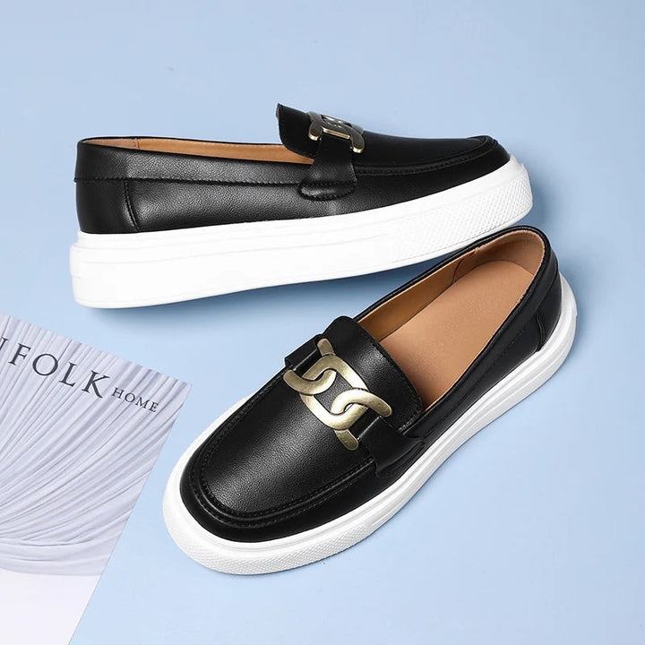 Elegant men's dress loafers with a unique modern buckle detail. Sophisticated slip-on footwear for any formal occasion.