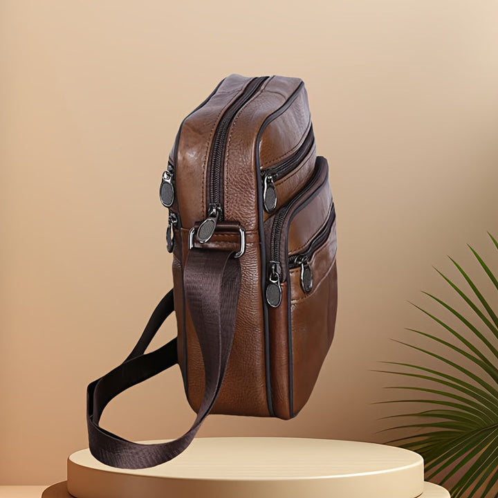 Black men's versatile shoulder bag, adjustable for work, travel & daily use.