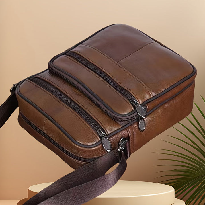 Coffee brown men's crossbody messenger bag, organized for daily essentials.