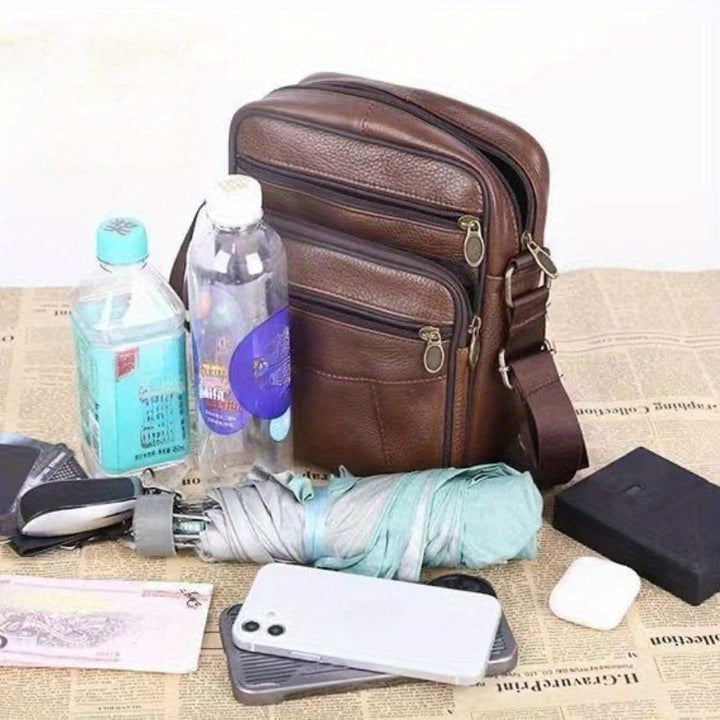 Men's black crossbody bag, spacious and durable, great for daily errands and travel.