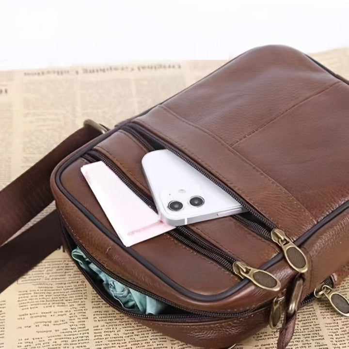 Spacious men's shoulder bag with adjustable strap, suitable for work, daily use, or travel.
