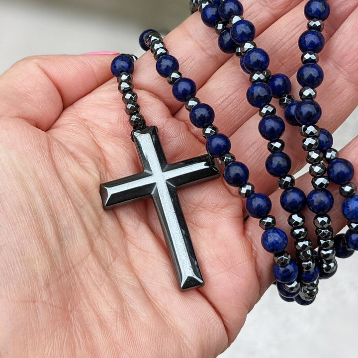 Stylish men's spiritual rosary necklace with gemstones, worn for protection & elegant look.