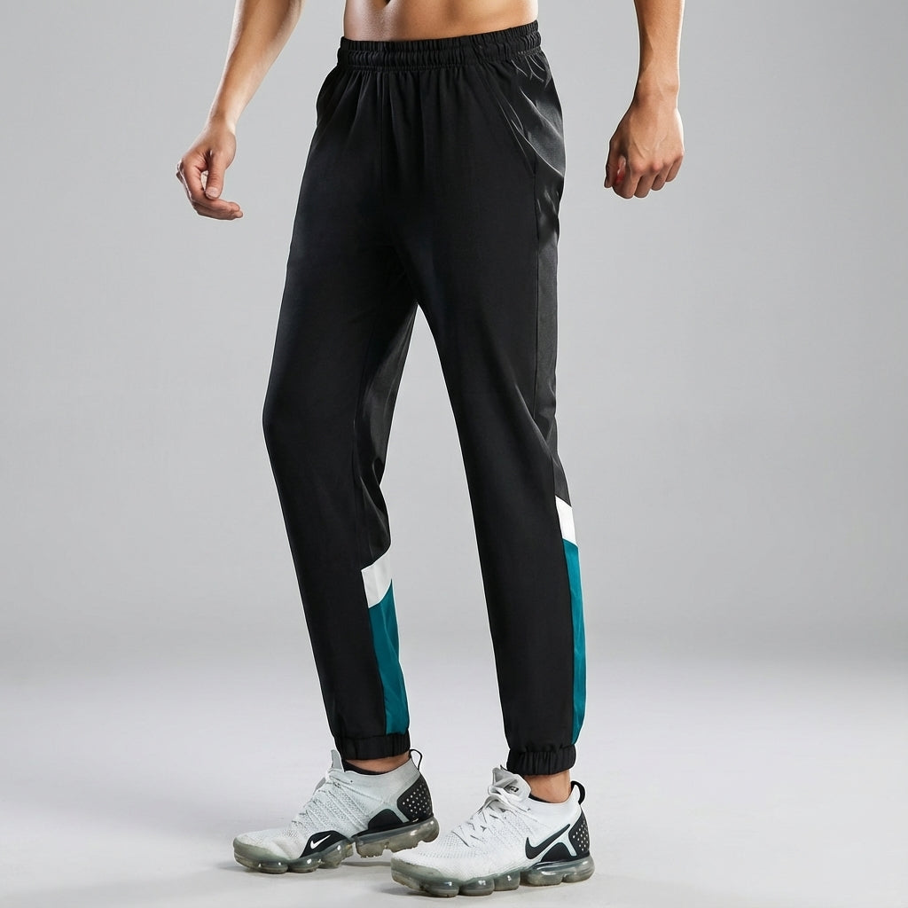 Men's sporty jogging trousers, versatile activewear pants in charcoal, perfect for training.