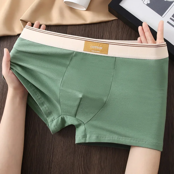 Men's mid-rise boxer briefs with sweat-wicking technology, designed for ultimate comfort & support.