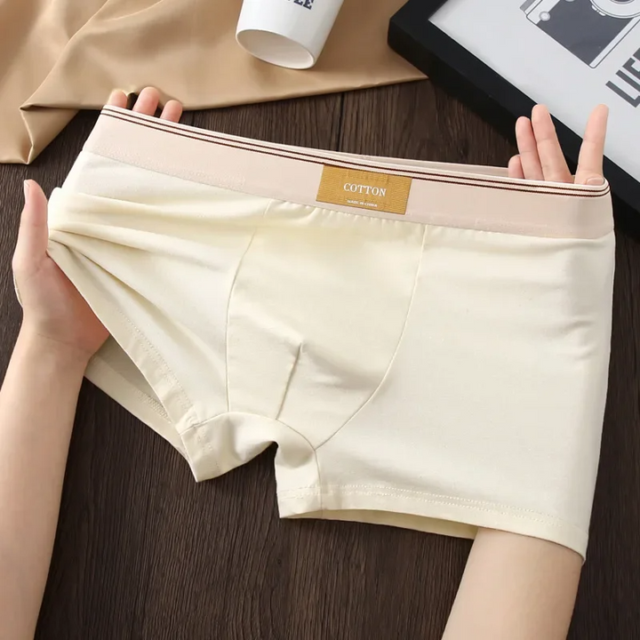 High-performance men's underwear, a 3-pack of mid-rise boxer briefs for athletic comfort.