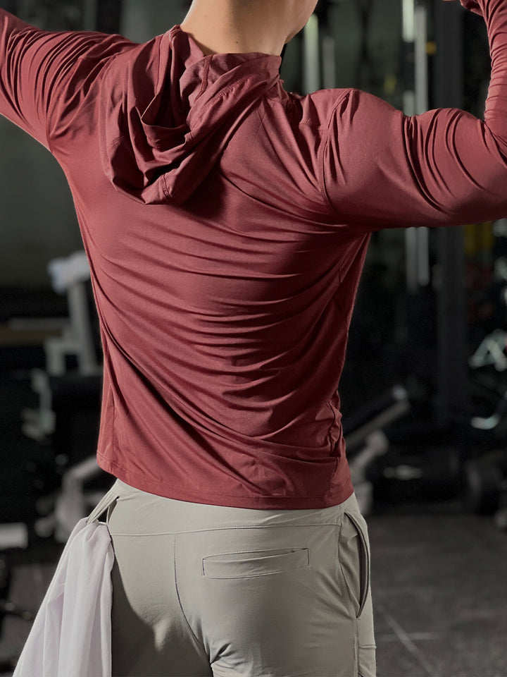 Modern men's baselayer hoodie, gym wear and running apparel with moisture-wicking properties.