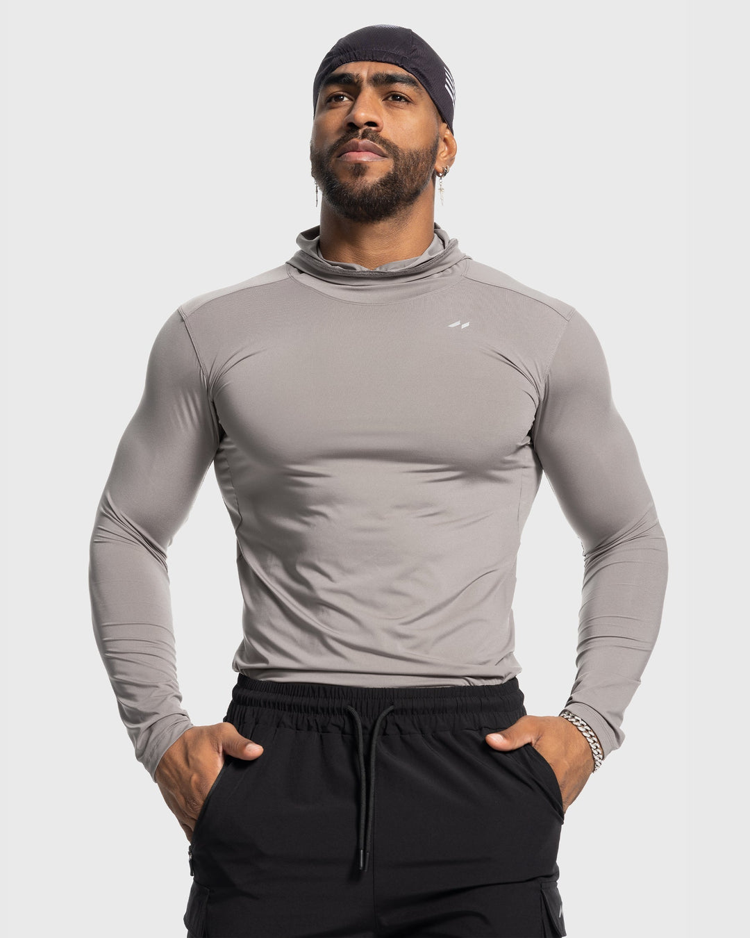 Stealth men's baselayer hoodie, a moisture-wicking top for gym wear and active performance.