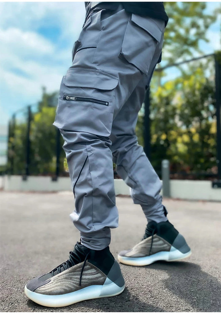 Water-resistant men's reflective cargo jogger pants, offering comfort and style for any activity.