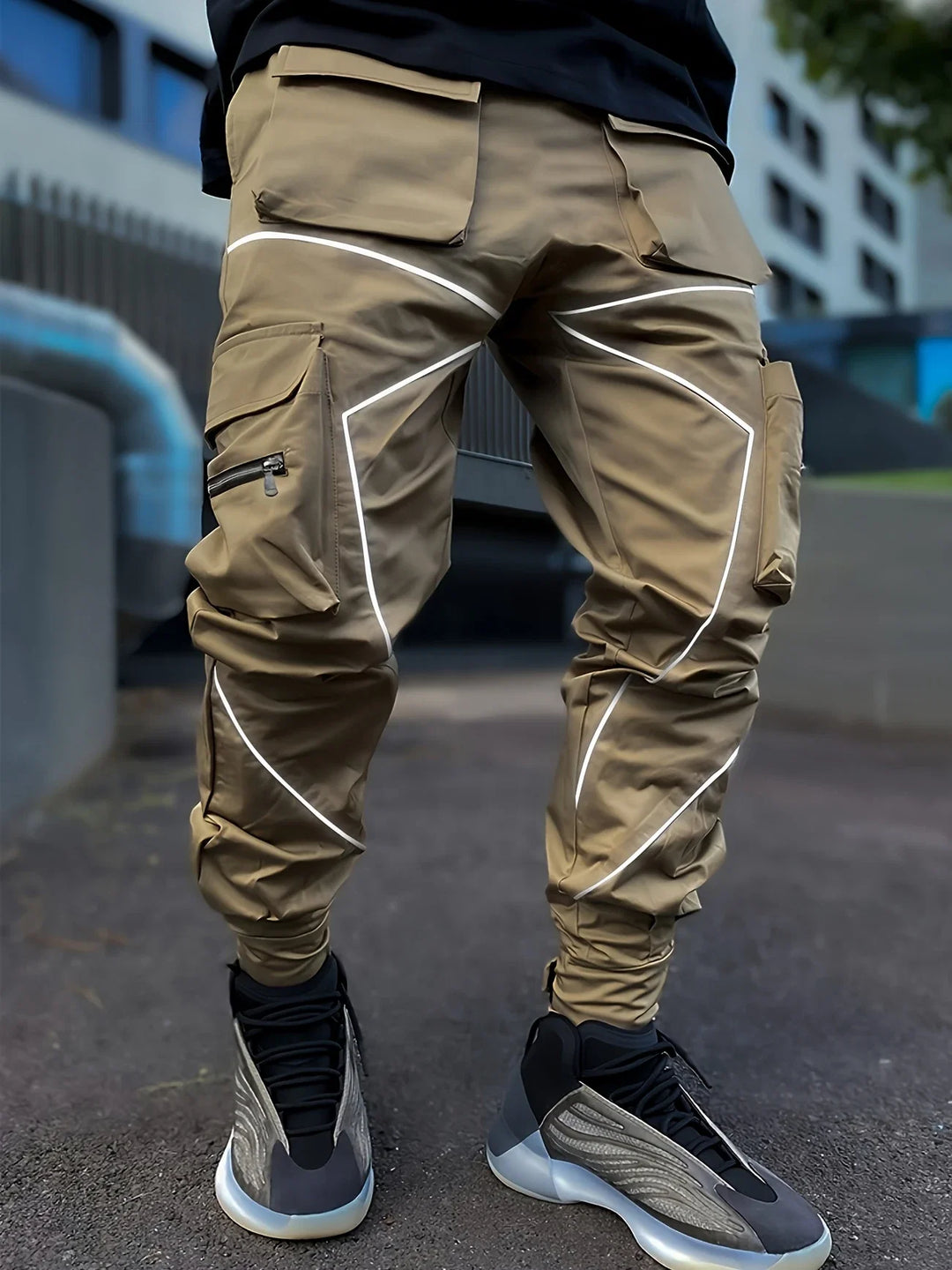 Men's comfortable athletic jogger pants with cargo pockets, featuring reflective elements.