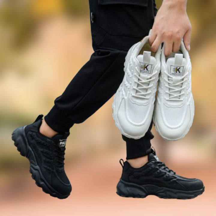 Anti-slip men's safety sneakers with steel toe, essential protective footwear for work.