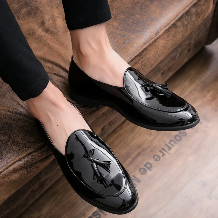 Elegant almond toe men's black loafers, polished leather, ideal for special occasions.