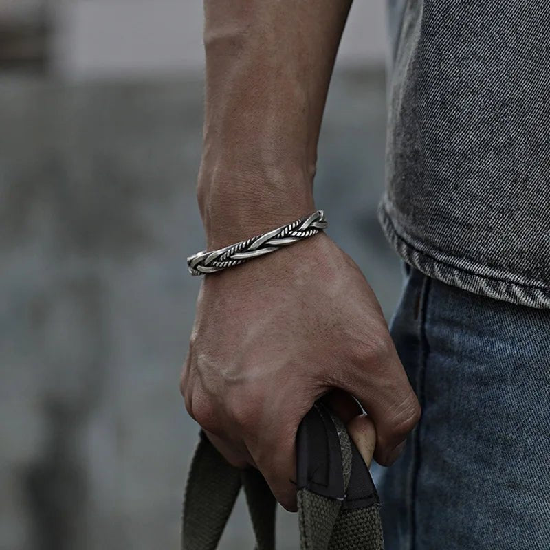 Men's sterling silver braided open cuff bracelet, a classic and adjustable silver accessory.