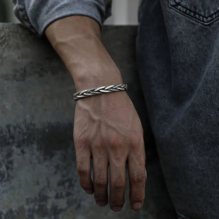 Adjustable men's sterling silver braided cuff bracelet, a comfortable and elegant piece of men's jewelry.