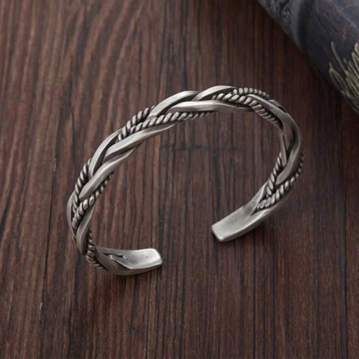 Handcrafted men's braided sterling silver open cuff bracelet, featuring an intricate design and oxidized finish.