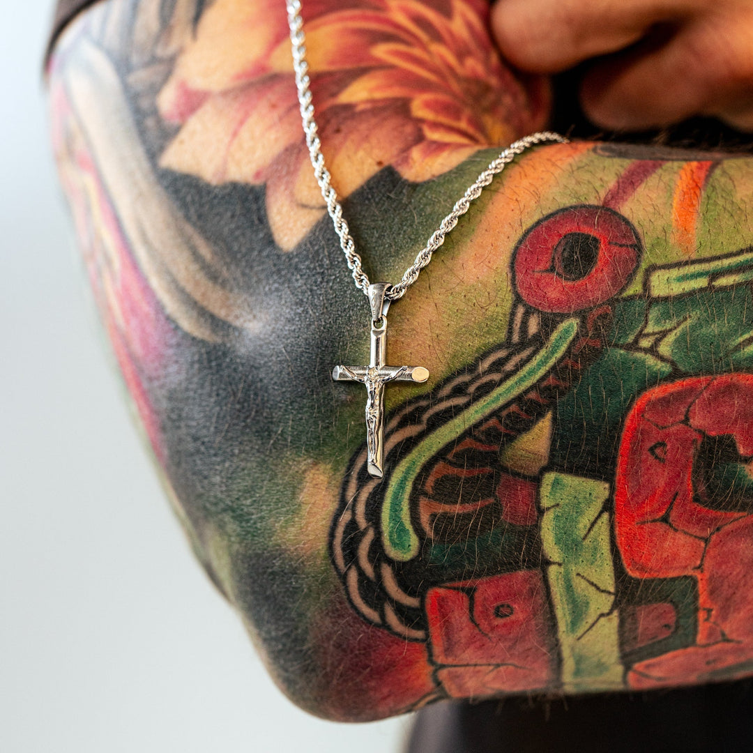 Durable sterling silver cross necklace for men, featuring a stylish gold-plated design for modern religious fashion.