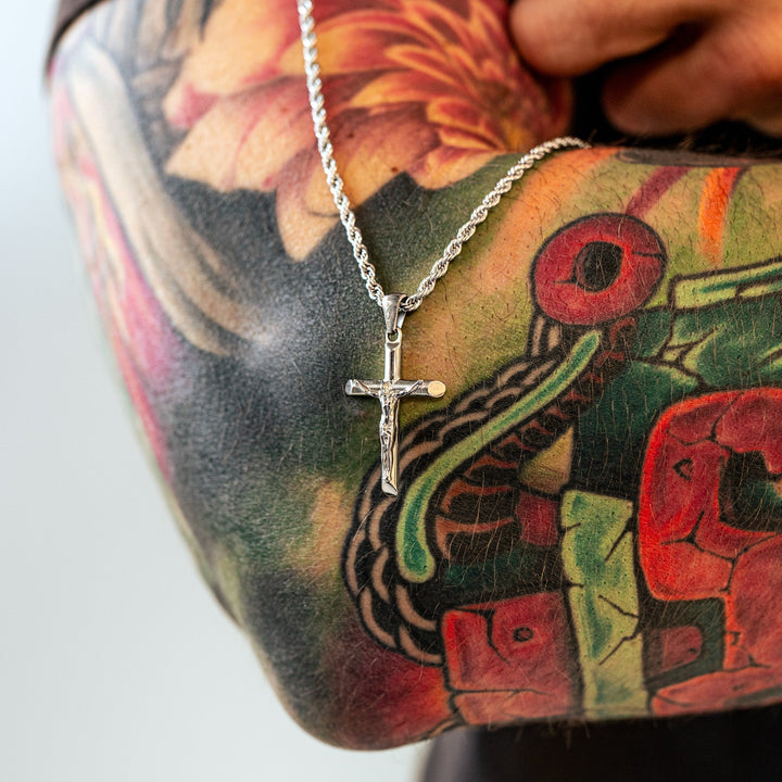 Durable sterling silver cross necklace for men, featuring a stylish gold-plated design for modern religious fashion.