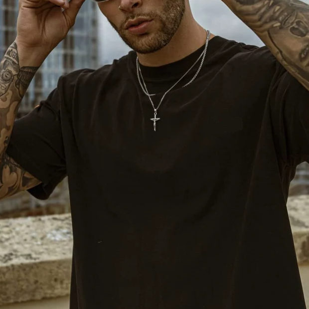 Stylish men's sterling silver cross pendant on a chain, a perfect spiritual gift for faith and daily wear.