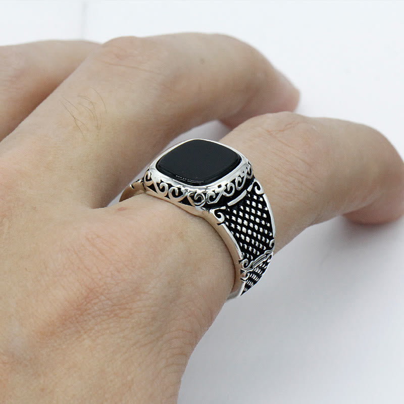 Rugged sterling silver men's ring with a striking black onyx gemstone, ideal for him.