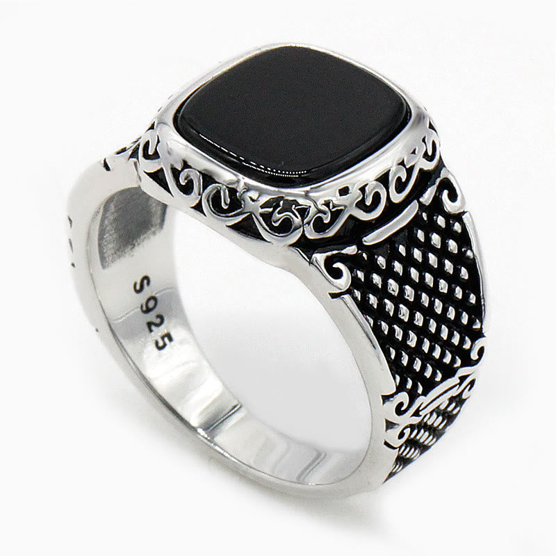 Handcrafted men's jewelry: sterling silver ring featuring a deep black onyx stone.