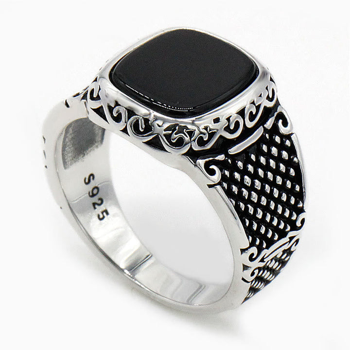 Handcrafted men's jewelry: sterling silver ring featuring a deep black onyx stone.