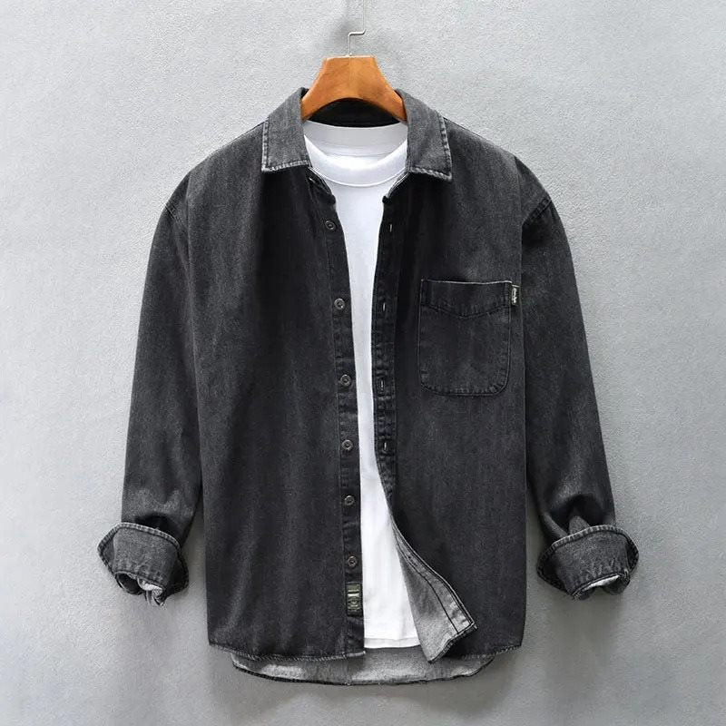 Close-up of a men's stone-washed shirt texture, highlighting the casual, vintage-style fabric. Long sleeve top.