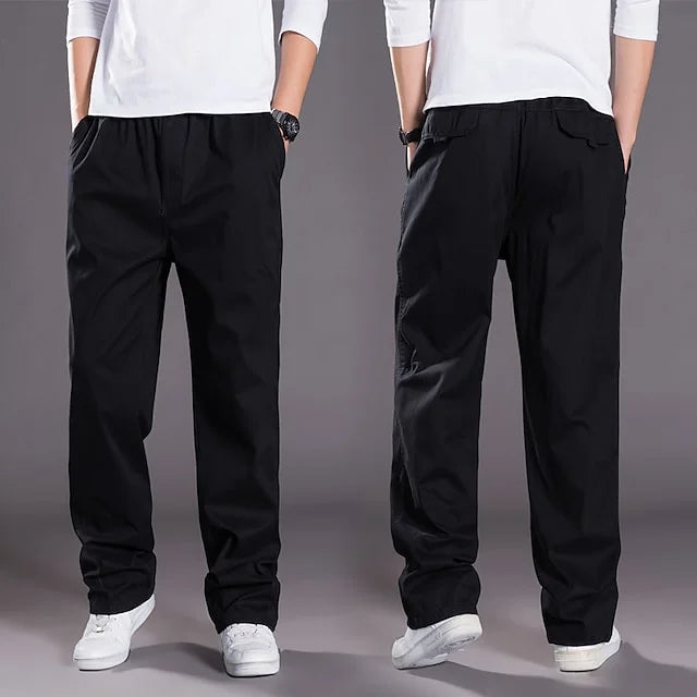 Versatile green men's cargo pants. Straight fit, elastic waist, & ample pockets for comfortable daily or outdoor wear.