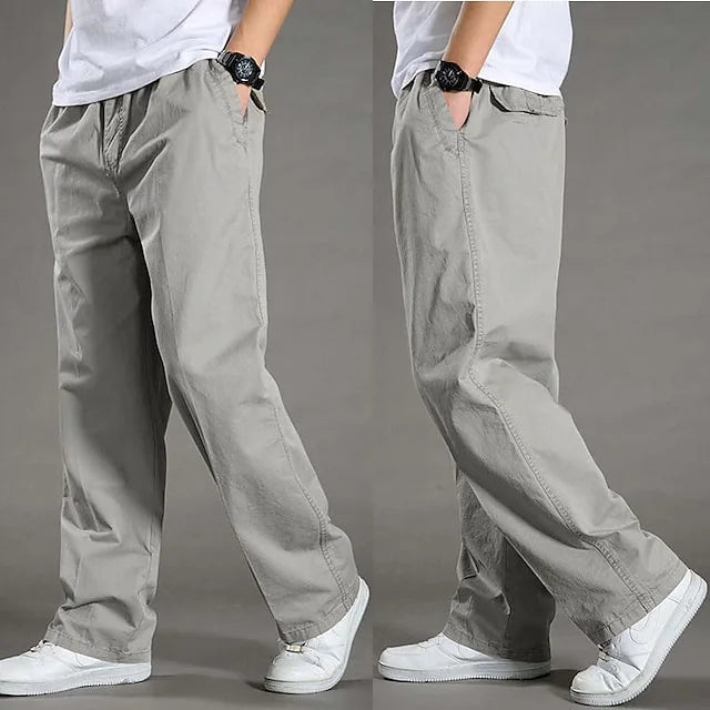 Gray men's straight fit cargo pants. Stylish and practical utility trousers with an elastic waist & multi-pockets.