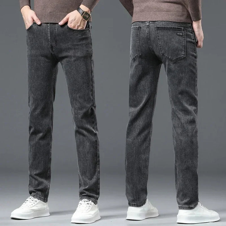 Stylish gray men's straight-leg stretch denim jeans, offering modern fit and all-day comfort.