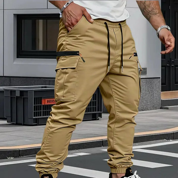 Stylish men's utility cargo joggers with stretch fabric & multiple pockets, ideal for activewear & travel.