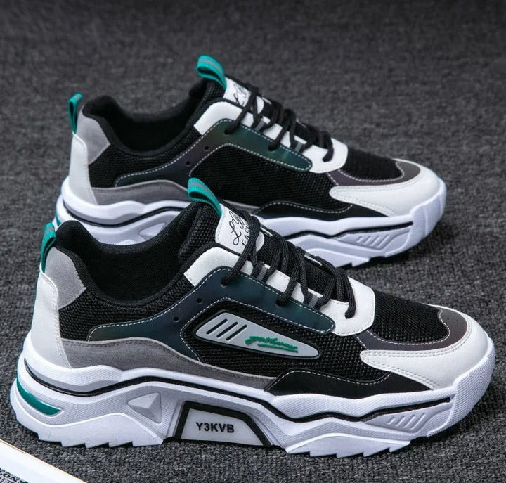 Men's StrideFlex athletic sneakers in black and green, ideal for running and sporty activities.