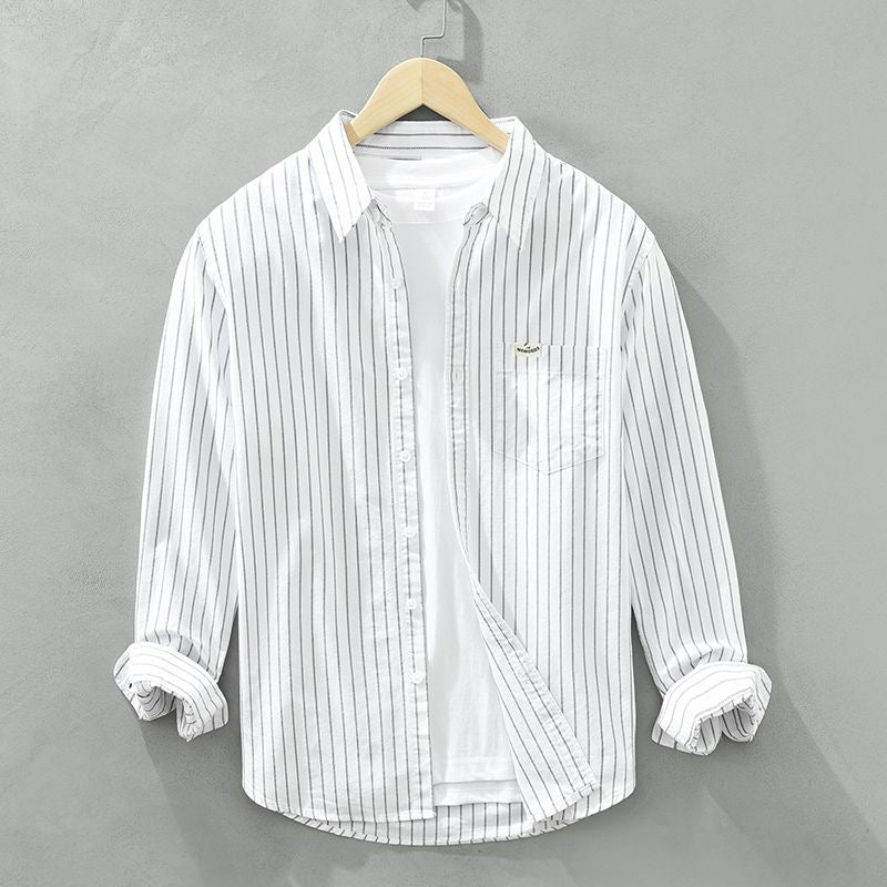 Comfortable men's striped button-up shirt in a modern fit, ideal for everyday fashion & menswear.