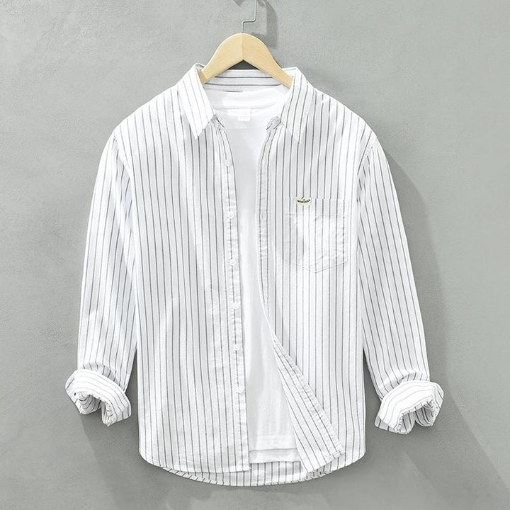 Comfortable men's striped button-up shirt in a modern fit, ideal for everyday fashion & menswear.