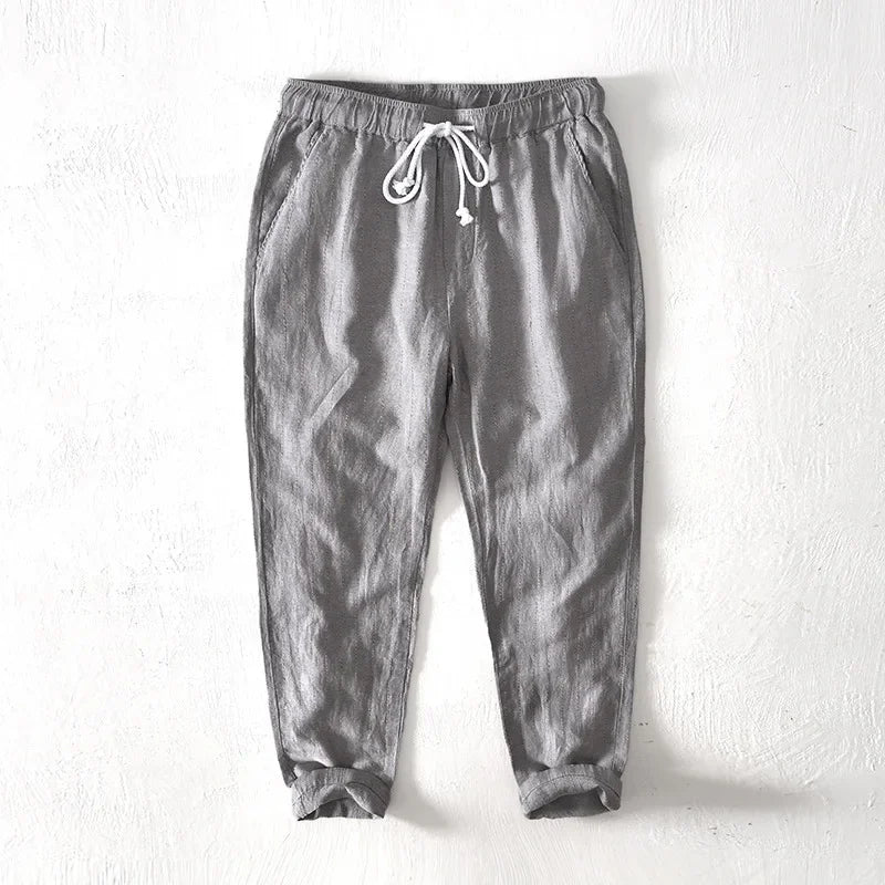 Stylish men's striped pants with drawstring, perfect for relaxed comfort and versatile fashion.