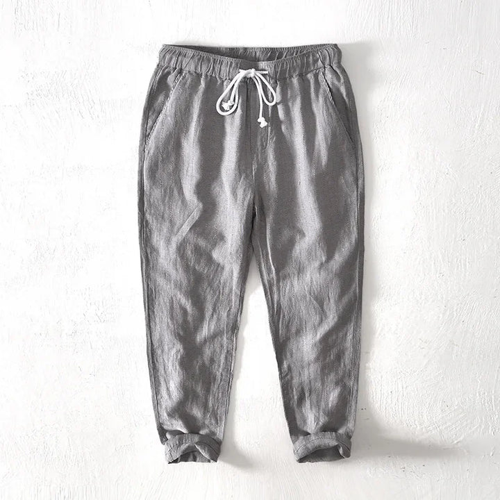Stylish men's striped pants with drawstring, perfect for relaxed comfort and versatile fashion.