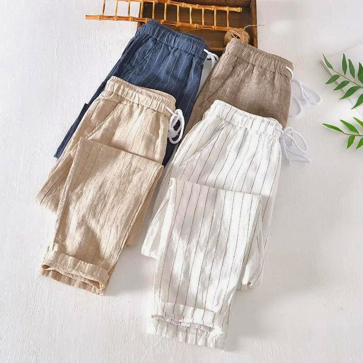Comfortable men's striped drawstring pants, relaxed fit trousers ideal for stylish and effortless everyday wear.