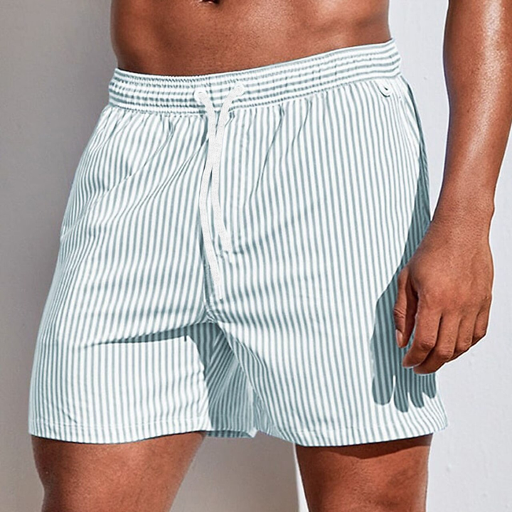 Stylish men's striped swim trunks, ideal for summer fashion, beachwear, and pool activities.