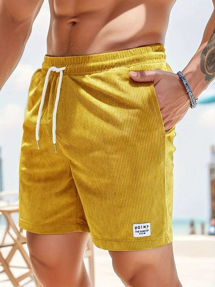 Close-up of men's striped summer shorts fabric, showing texture and comfortable design